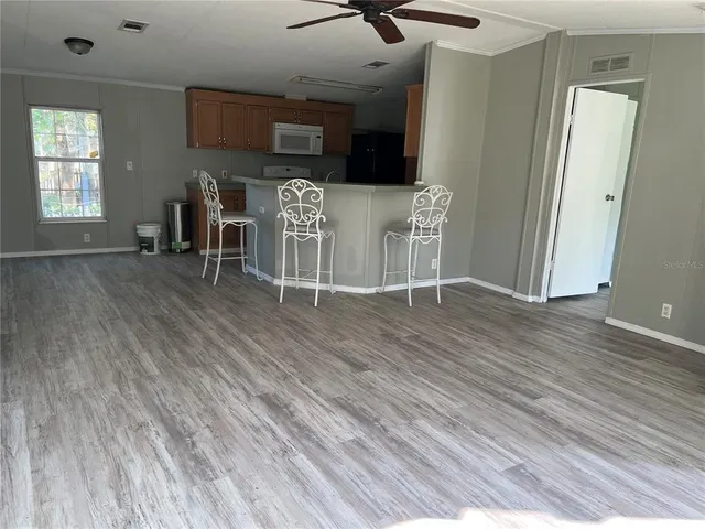 a view of a livingroom with furniture and windows