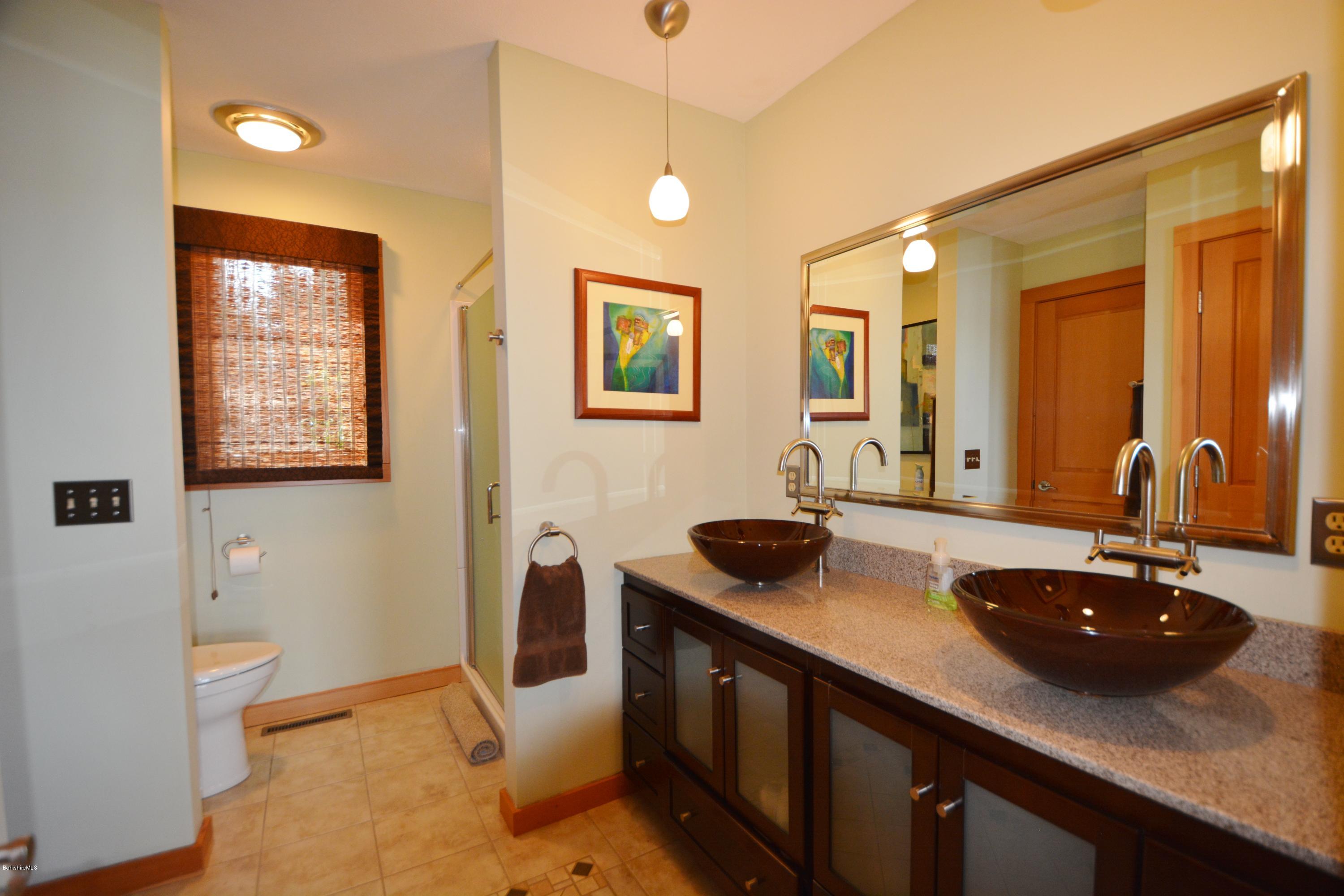 408 Pine Road Otis, MA 01029 - Photo 22 of 35 a kitchen with a sink and a stove with wooden floor