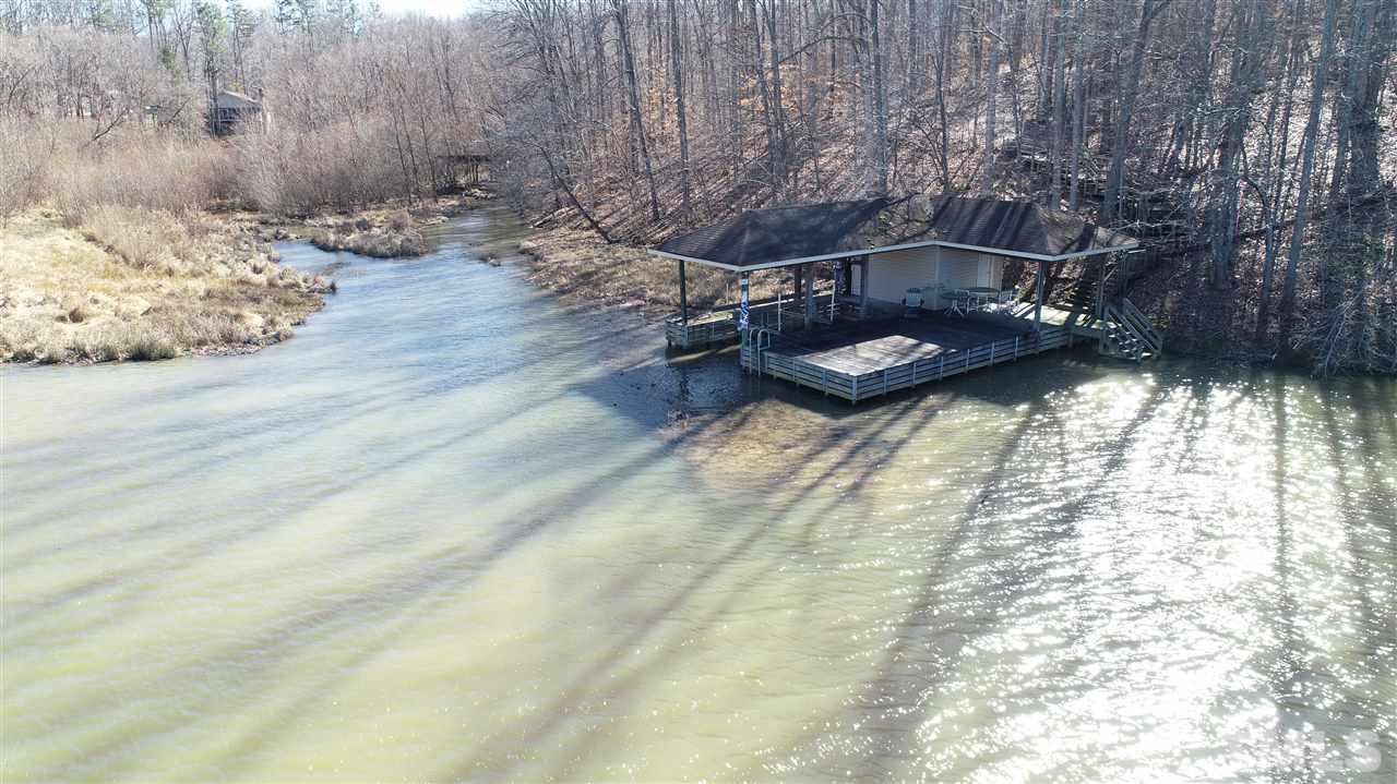 Lot 12 Duck Point Roxboro, NC 27574 - Photo 1 of 5 a backyard of a house with table and chairs