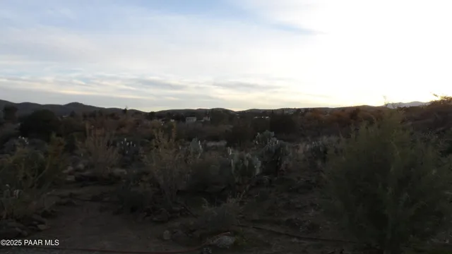 an aerial view of a house and mountain view