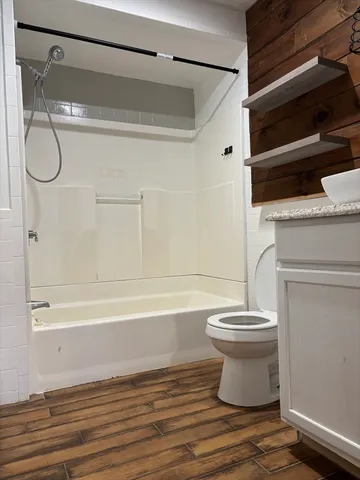 a bathroom with a shower and a toilet