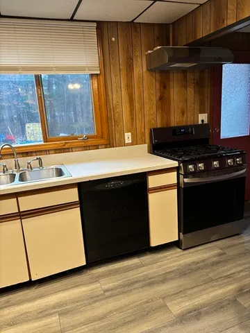 a kitchen with a stove and a microwave