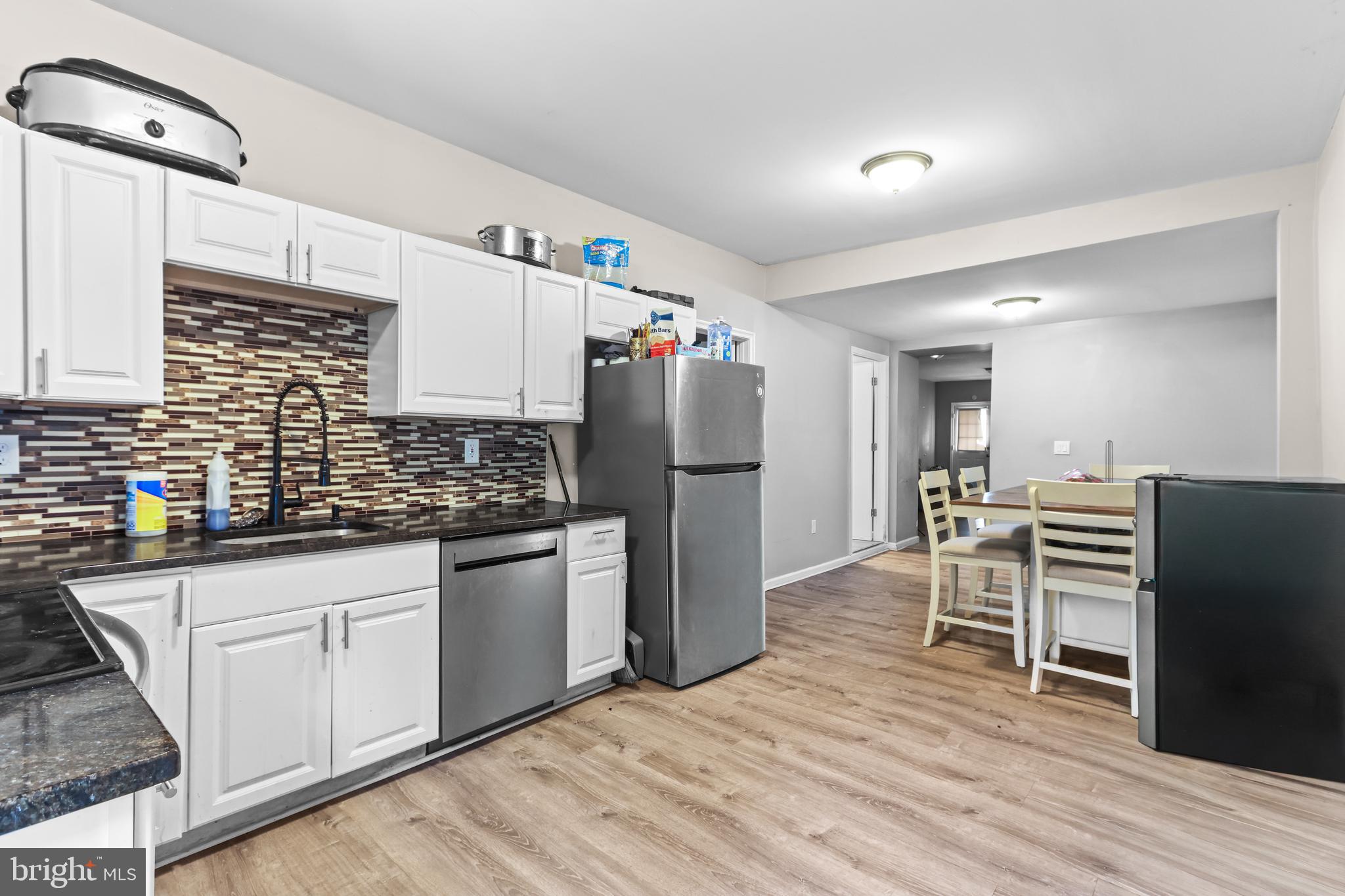 12 South Front Street Coplay, PA 18037 - Photo 25 of 42 a kitchen with stainless steel appliances granite countertop a refrigerator sink and wooden cabinets