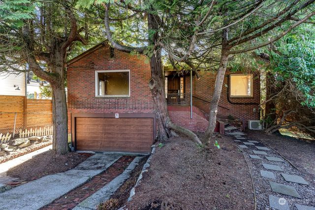 a front view of a house with parking