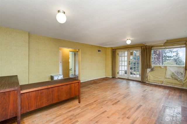 a view of a livingroom with furniture and a fireplace