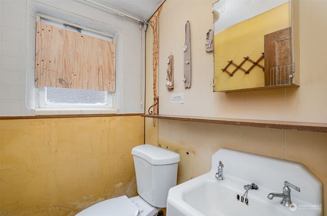 a view of staircase with wooden floor and chair