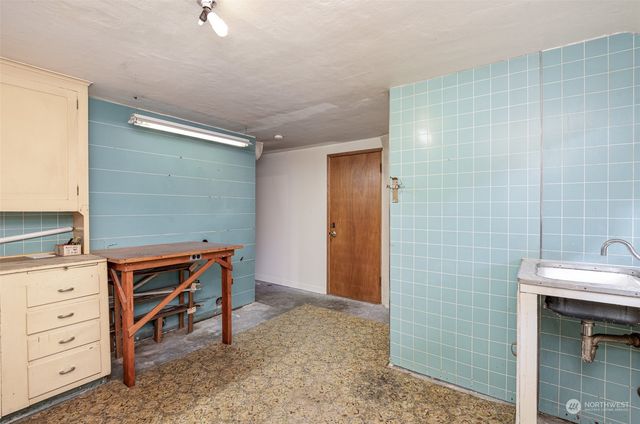 a view of a yard with plants and a trees