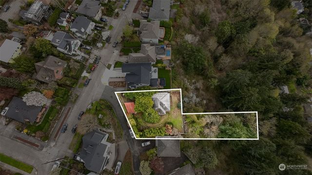 a backyard of a house with barbeque oven