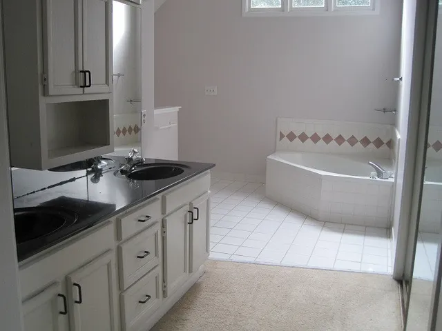 a bathroom with a bathtub and a sink