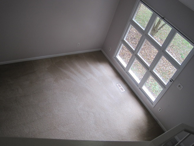 314 King George Loop Cary, NC 27511 - Photo 7 of 23 a view of an empty room with wooden floor and a window