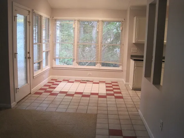 a view of empty room with windows