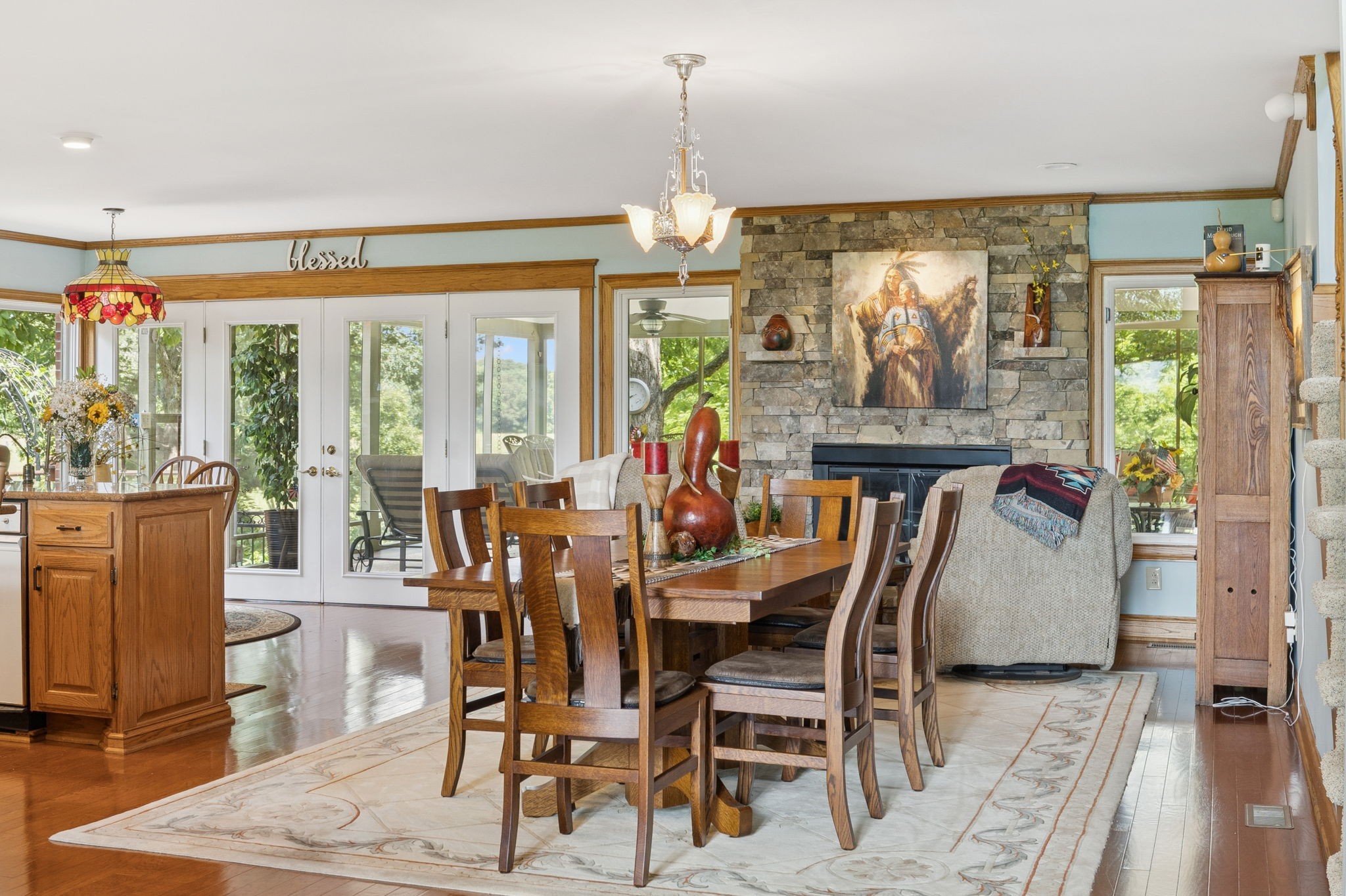 3225 Pinson School Road Greenbrier, TN 37073 - Photo 14 of 96 a dining room with furniture a chandelier and wooden floor