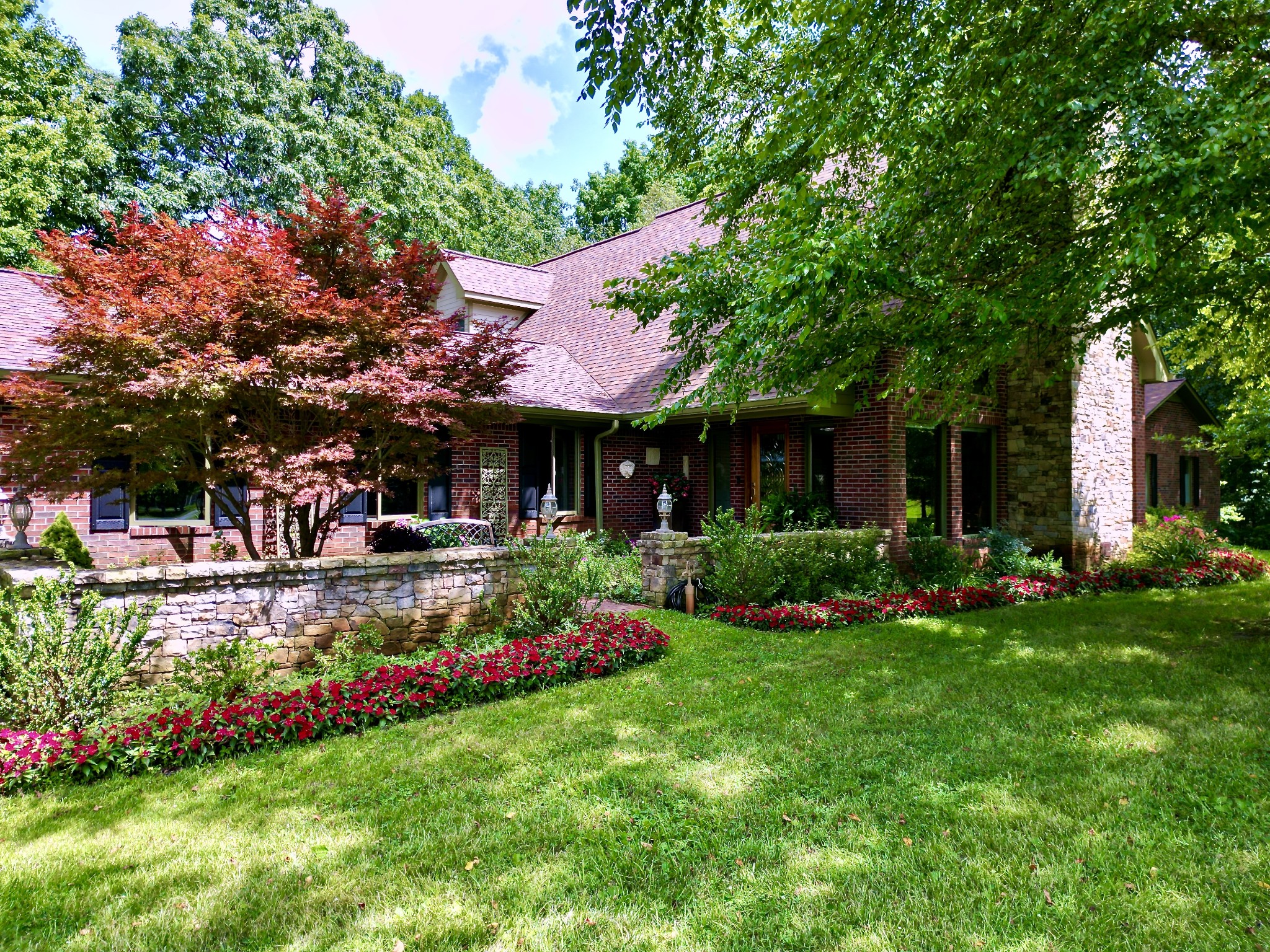 3225 Pinson School Road Greenbrier, TN 37073 - Photo 4 of 96 a view of a patio with table and chairs potted plants and large tree