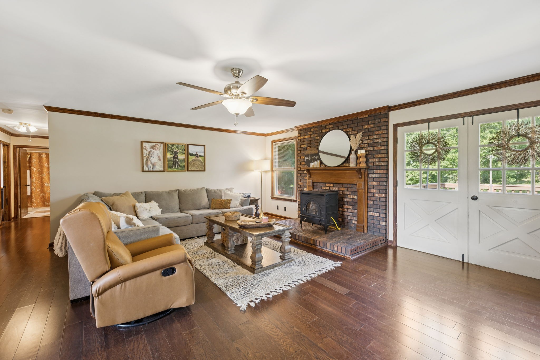 3225 Pinson School Road Greenbrier, TN 37073 - Photo 53 of 96 a living room with furniture a fireplace and wooden floor