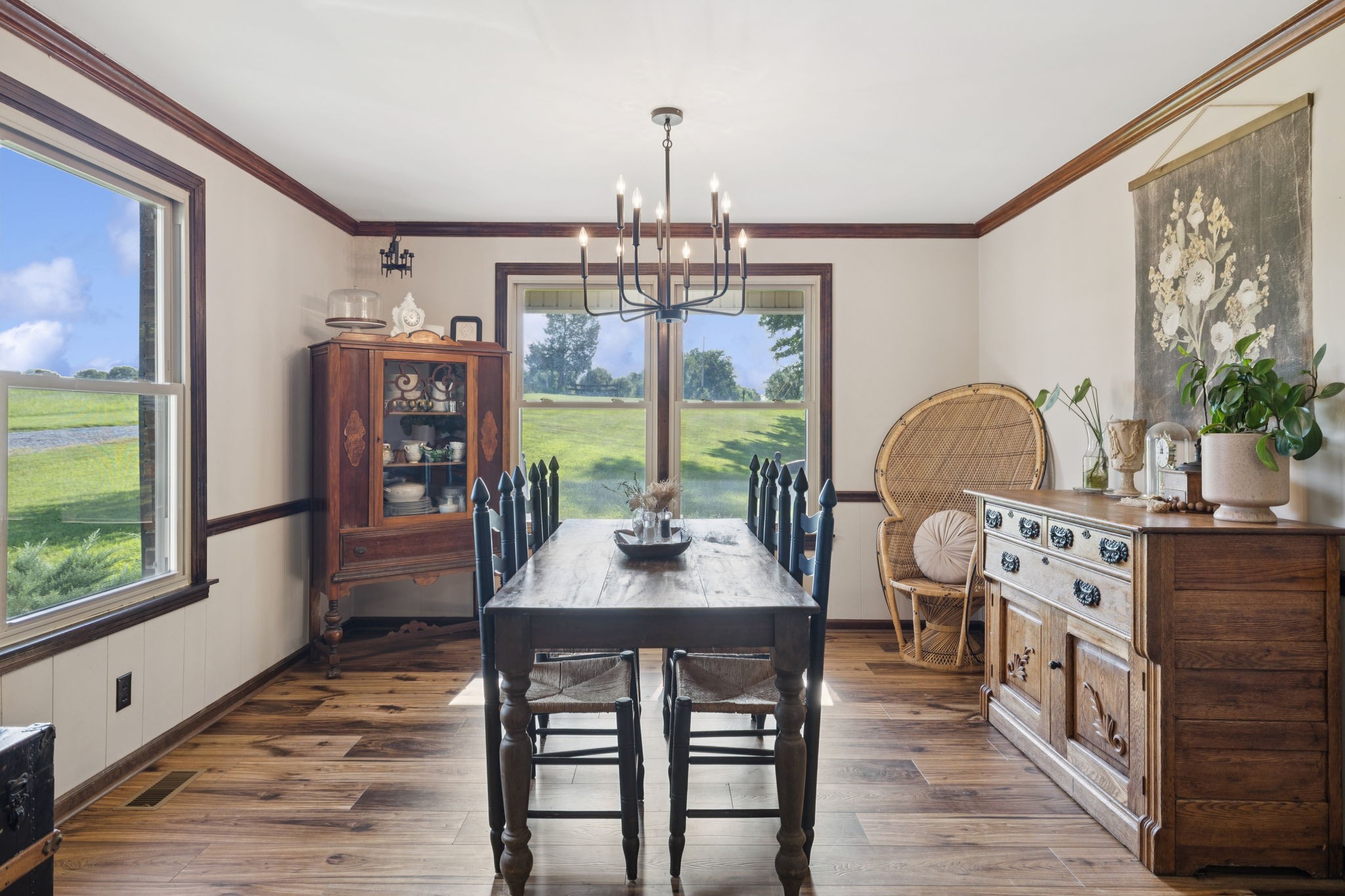 3225 Pinson School Road Greenbrier, TN 37073 - Photo 62 of 96 a dining room with furniture a chandelier and wooden floor