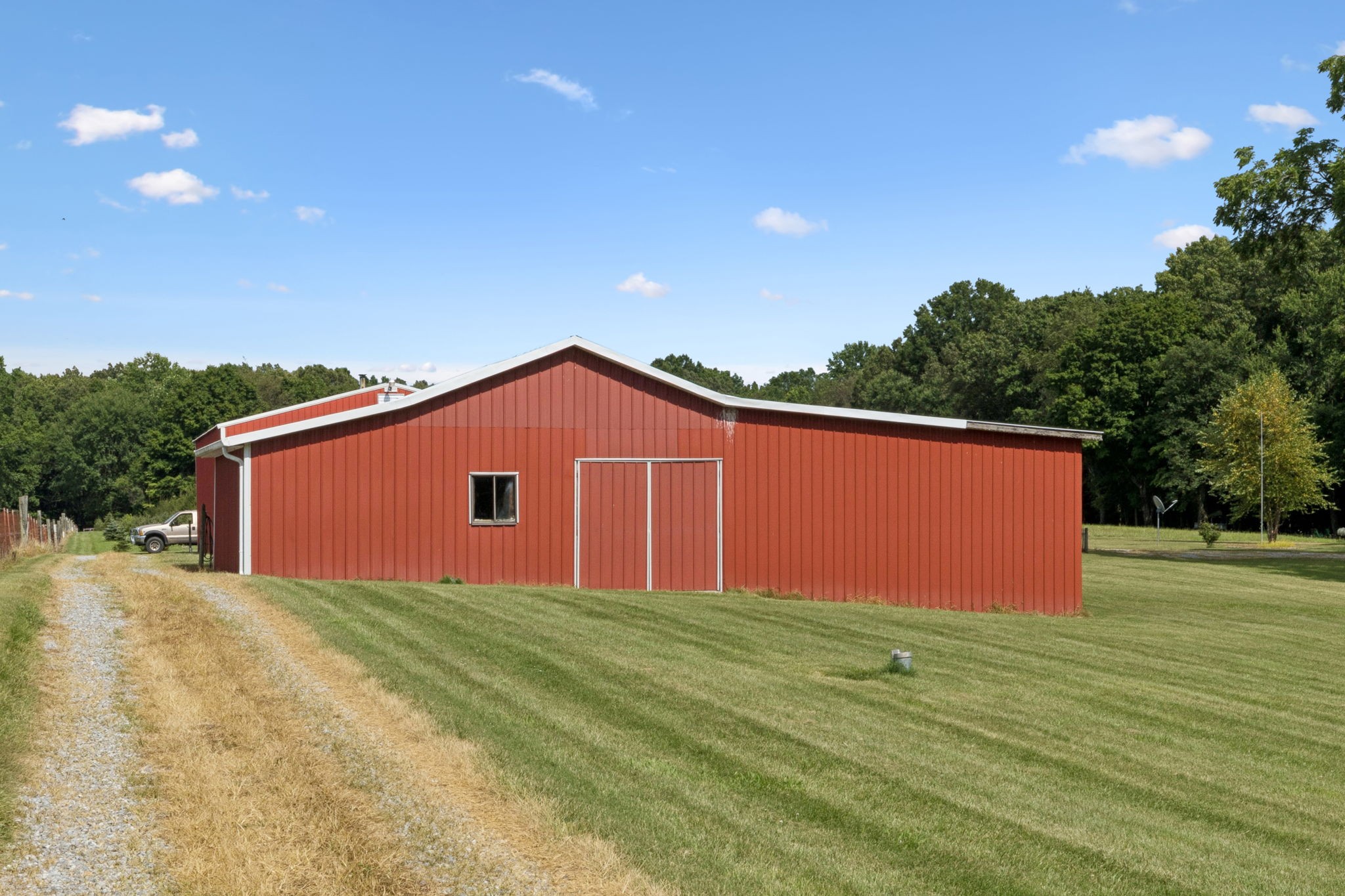 3225 Pinson School Road Greenbrier, TN 37073 - Photo 65 of 96 a front view of a house with a yard and garage