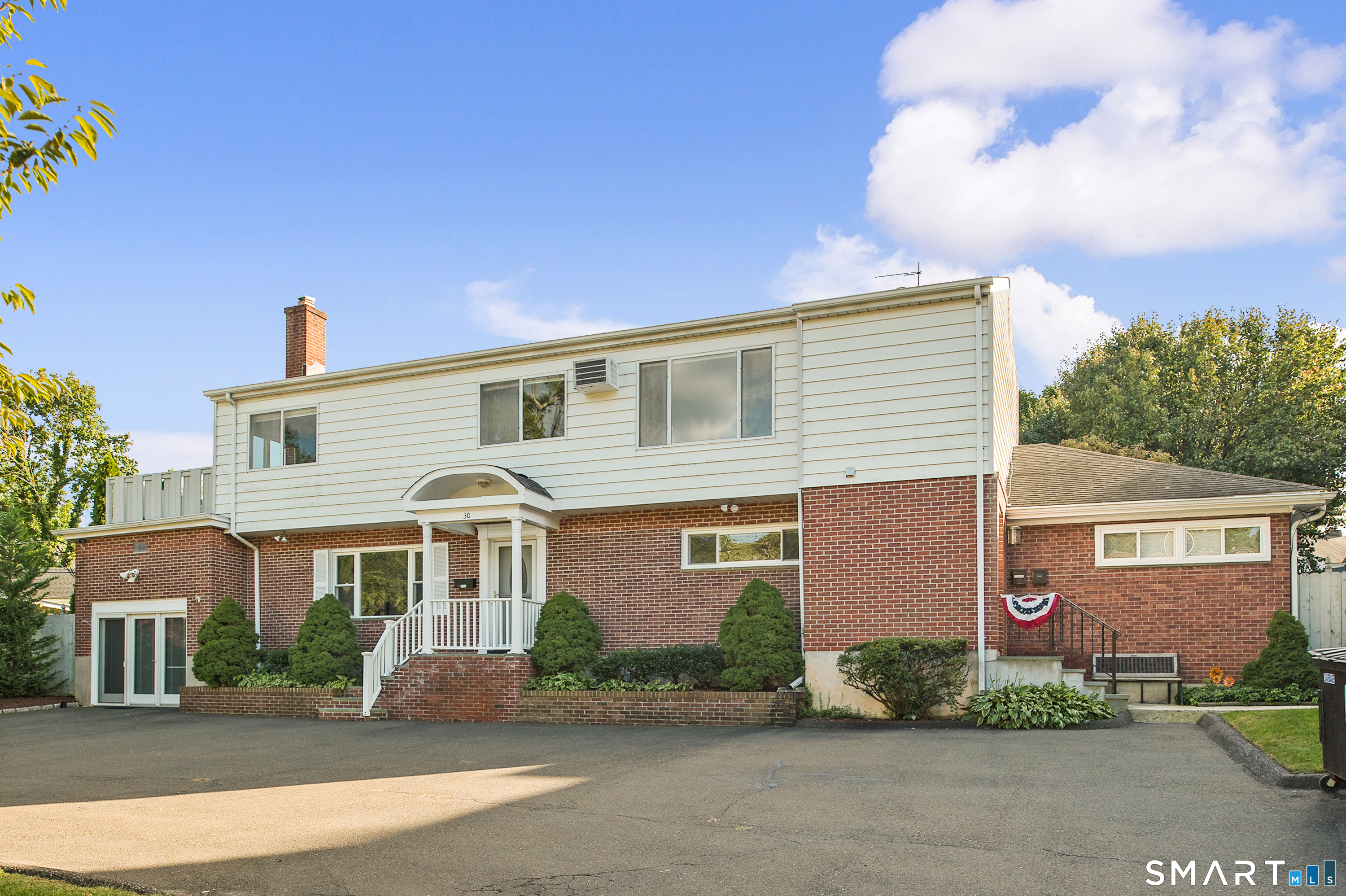 front view of a house with a street