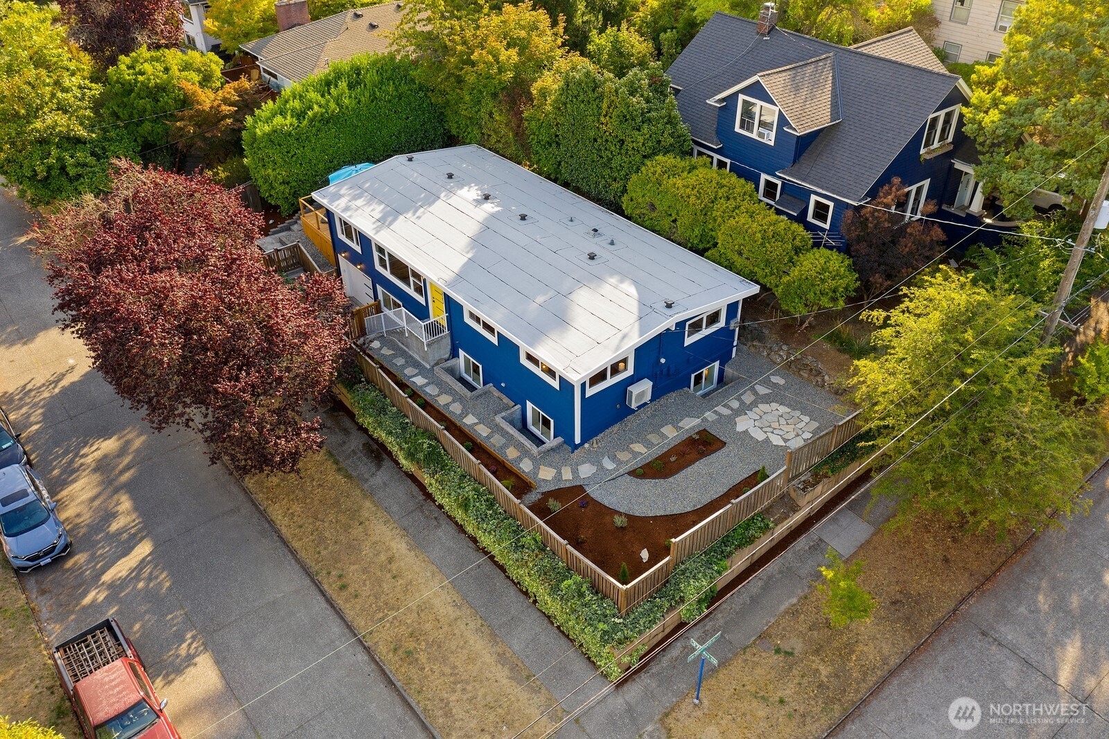 an aerial view of a house with a backyard