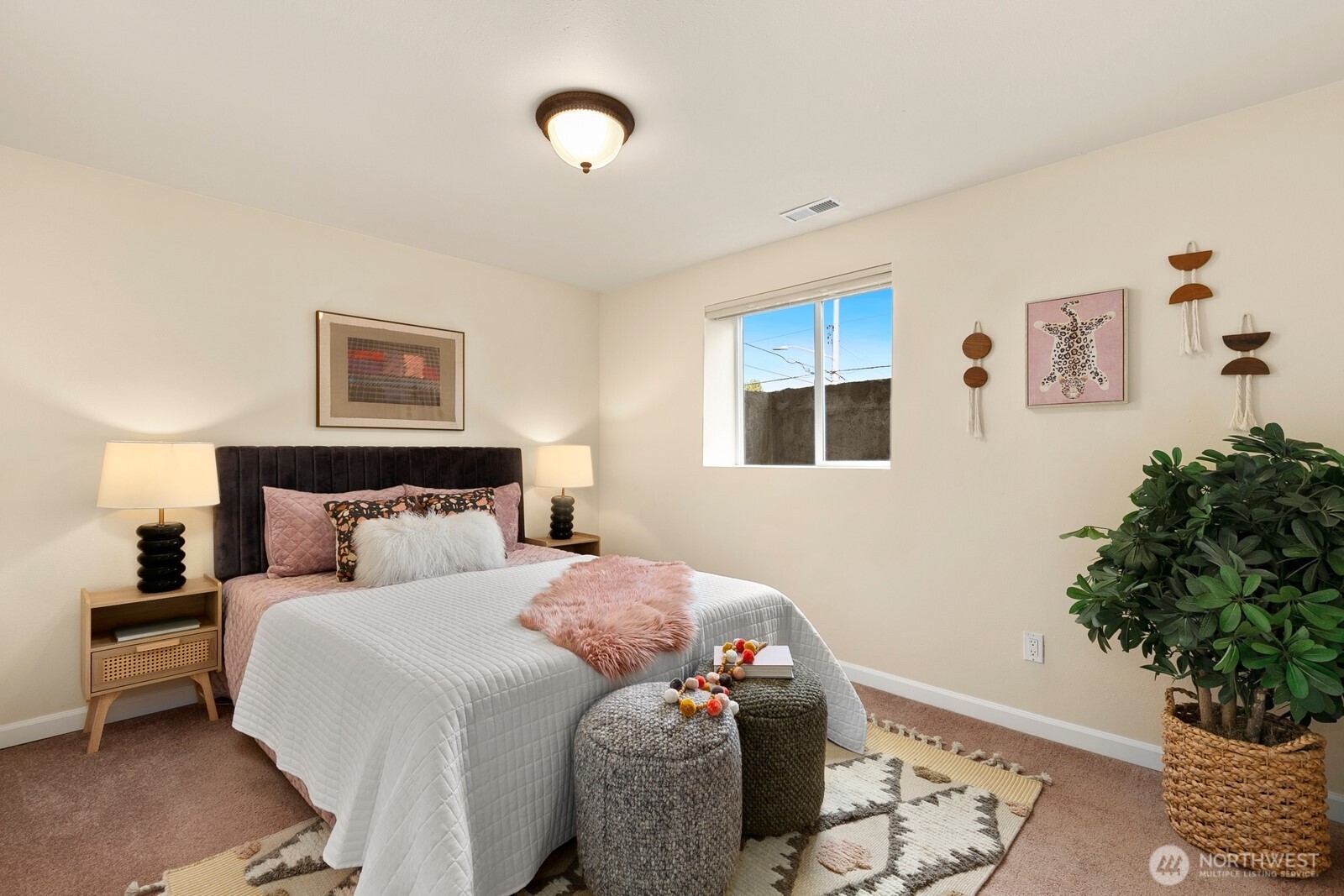 3701 Southwest Southern Street Seattle, WA 98126 - Photo 22 of 33 a bedroom with a bed and a potted plant