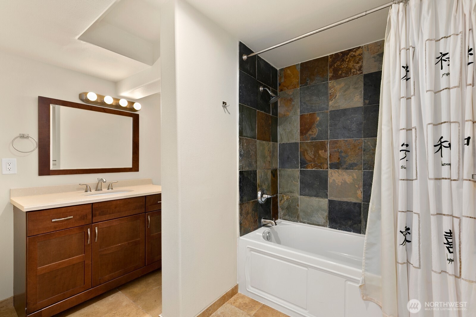 3701 Southwest Southern Street Seattle, WA 98126 - Photo 23 of 33 a bathroom with a bathtub a mirror a vanity and a shower