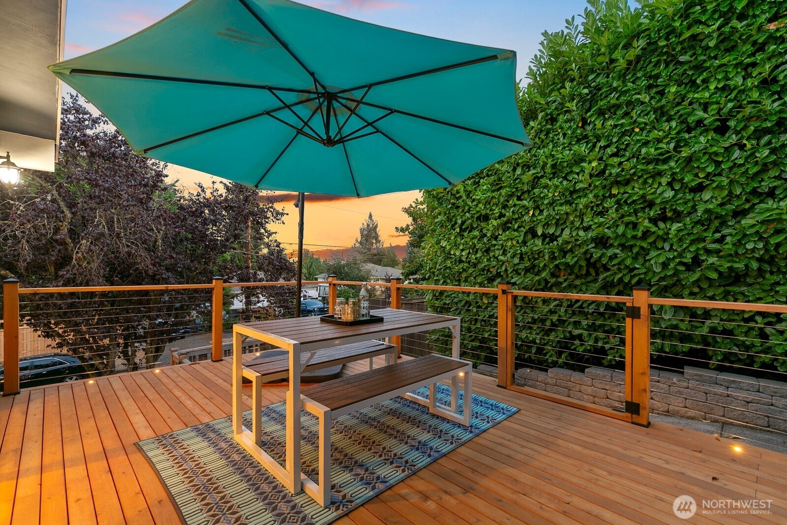 3701 Southwest Southern Street Seattle, WA 98126 - Photo 25 of 33 a view of a balcony with wooden floor and umbrella