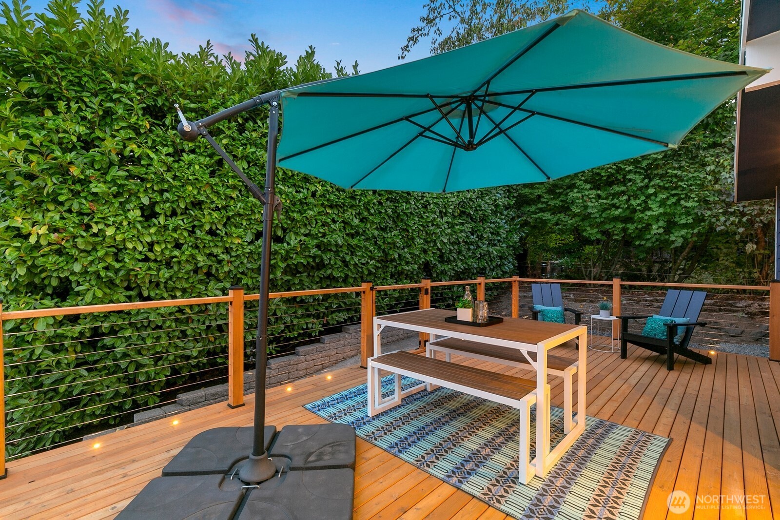 3701 Southwest Southern Street Seattle, WA 98126 - Photo 27 of 33 an outdoor sitting area with furniture and umbrella