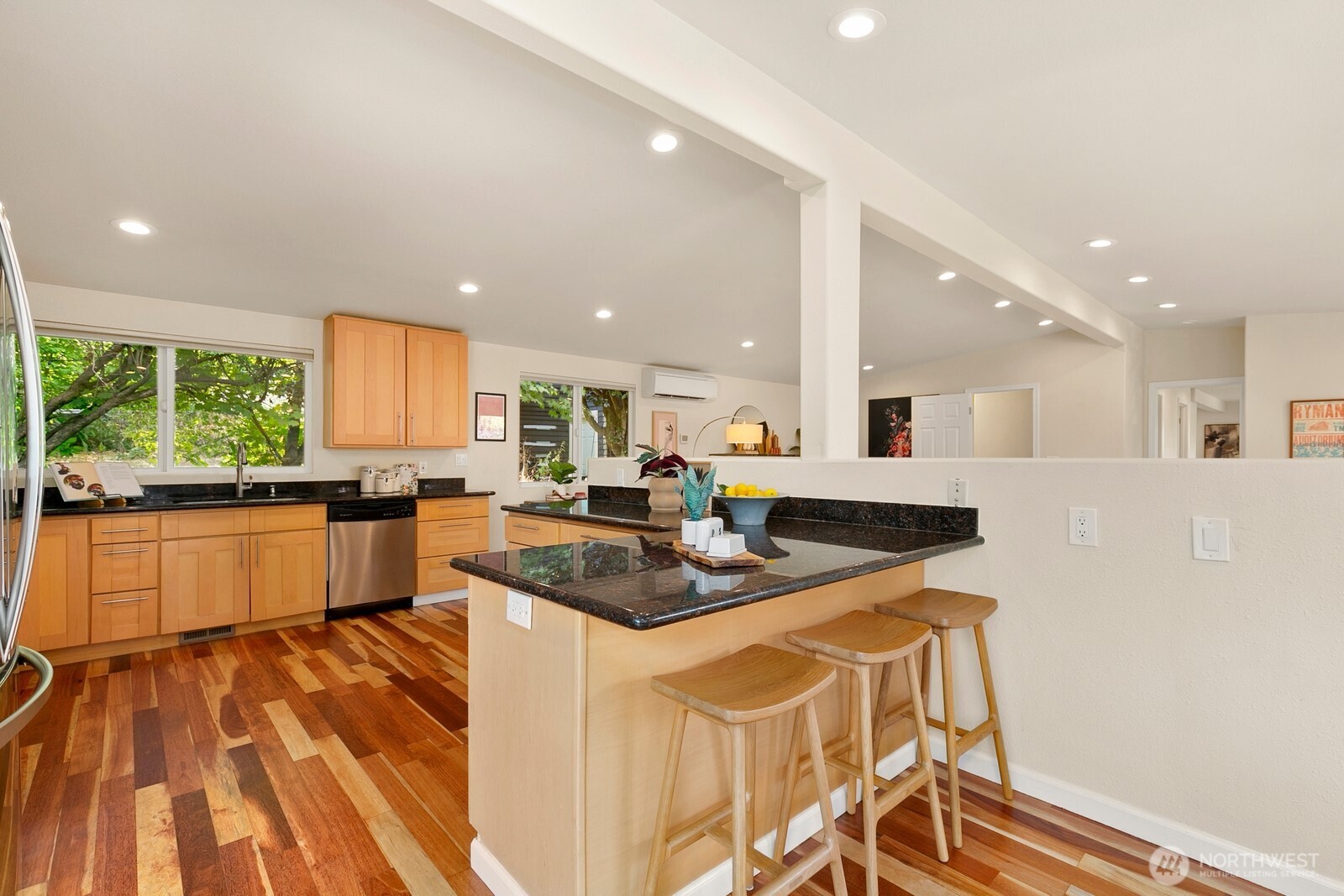 3701 Southwest Southern Street Seattle, WA 98126 - Photo 9 of 33 a kitchen with stainless steel appliances granite countertop a sink and a white cabinets