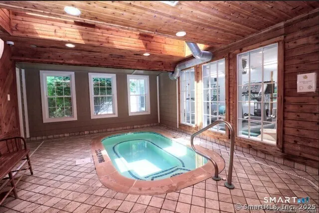 an aerial view of residential house with outdoor space and swimming pool