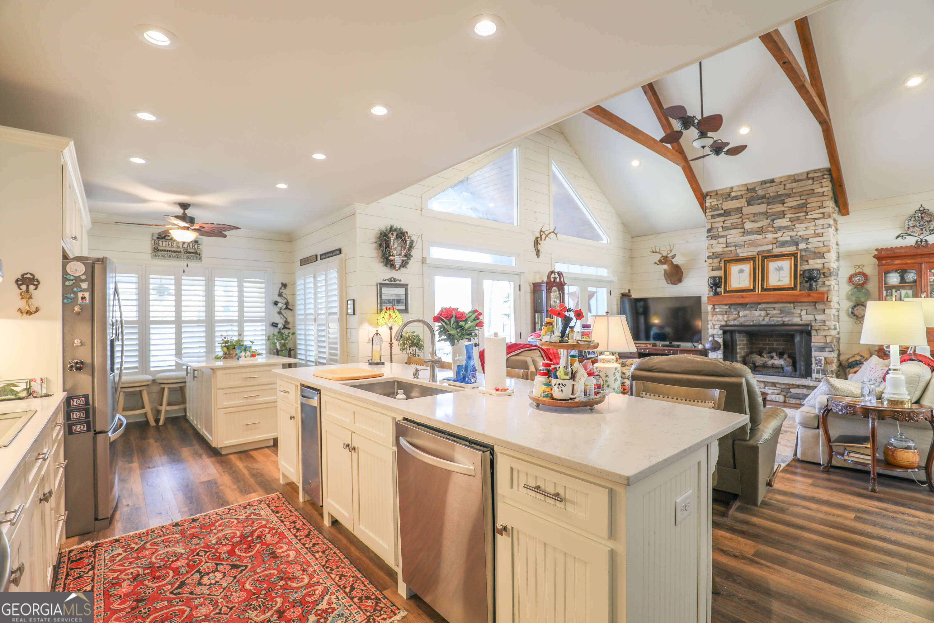 124 Myrick Road Northwest Milledgeville, GA 31061 - Photo 19 of 41 a kitchen with stainless steel appliances kitchen island granite countertop a stove and cabinets