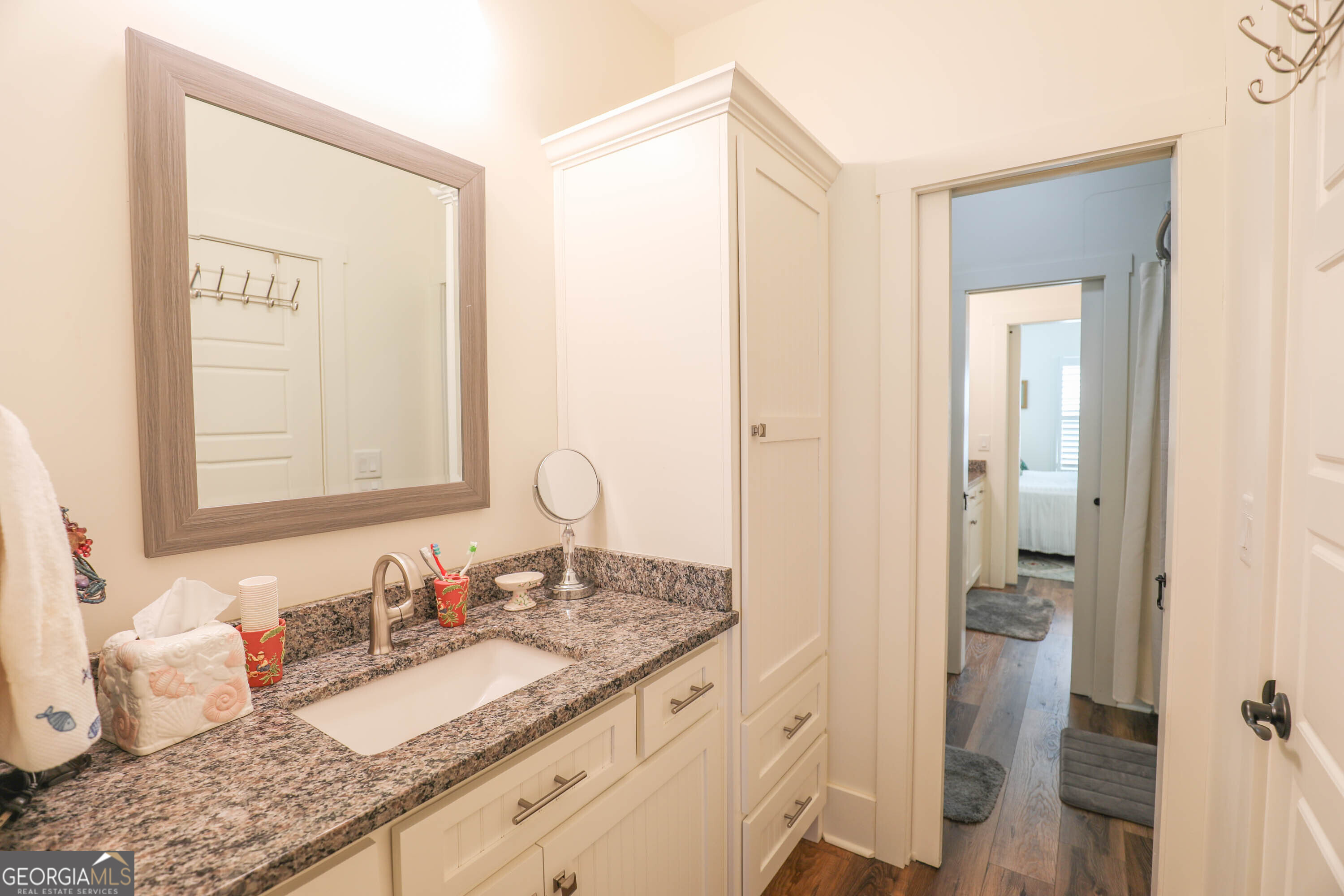 124 Myrick Road Northwest Milledgeville, GA 31061 - Photo 24 of 41 a bathroom with a granite countertop sink and a mirror