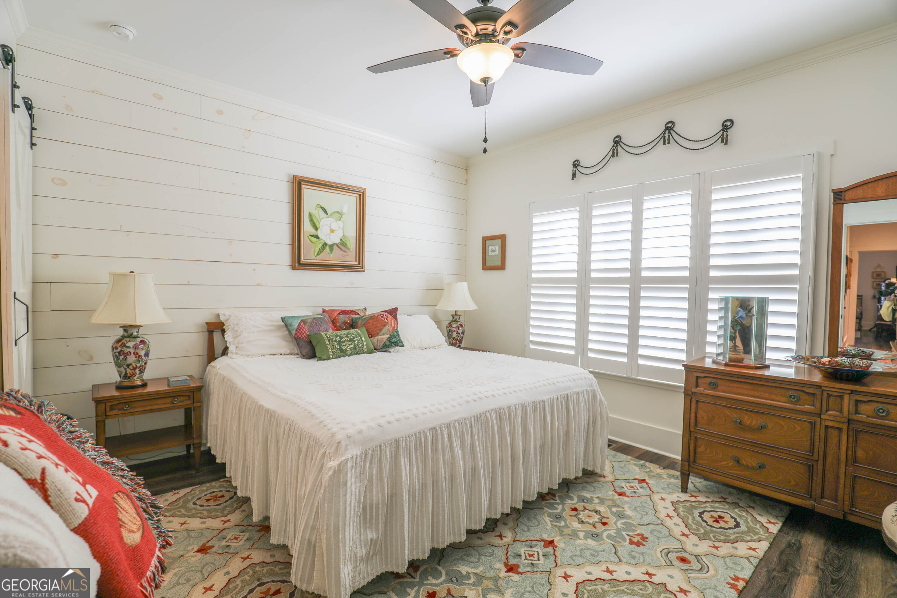 124 Myrick Road Northwest Milledgeville, GA 31061 - Photo 26 of 41 a bedroom with a bed and a chandelier