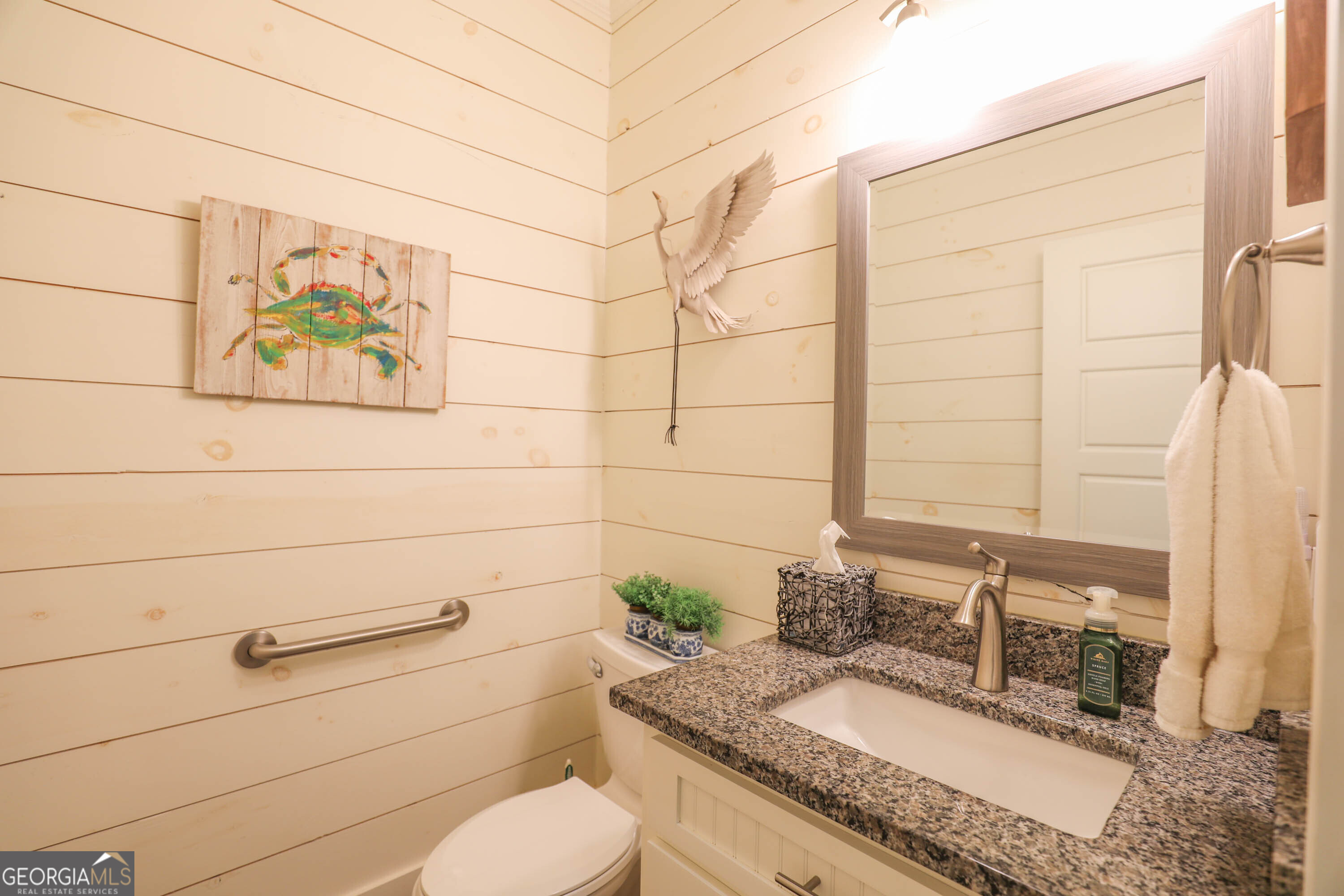 124 Myrick Road Northwest Milledgeville, GA 31061 - Photo 29 of 41 a bathroom with a granite countertop sink and a mirror