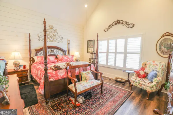 a living room with furniture a rug and a chandelier