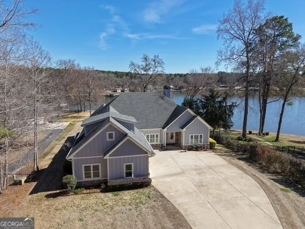 a house with trees in the background