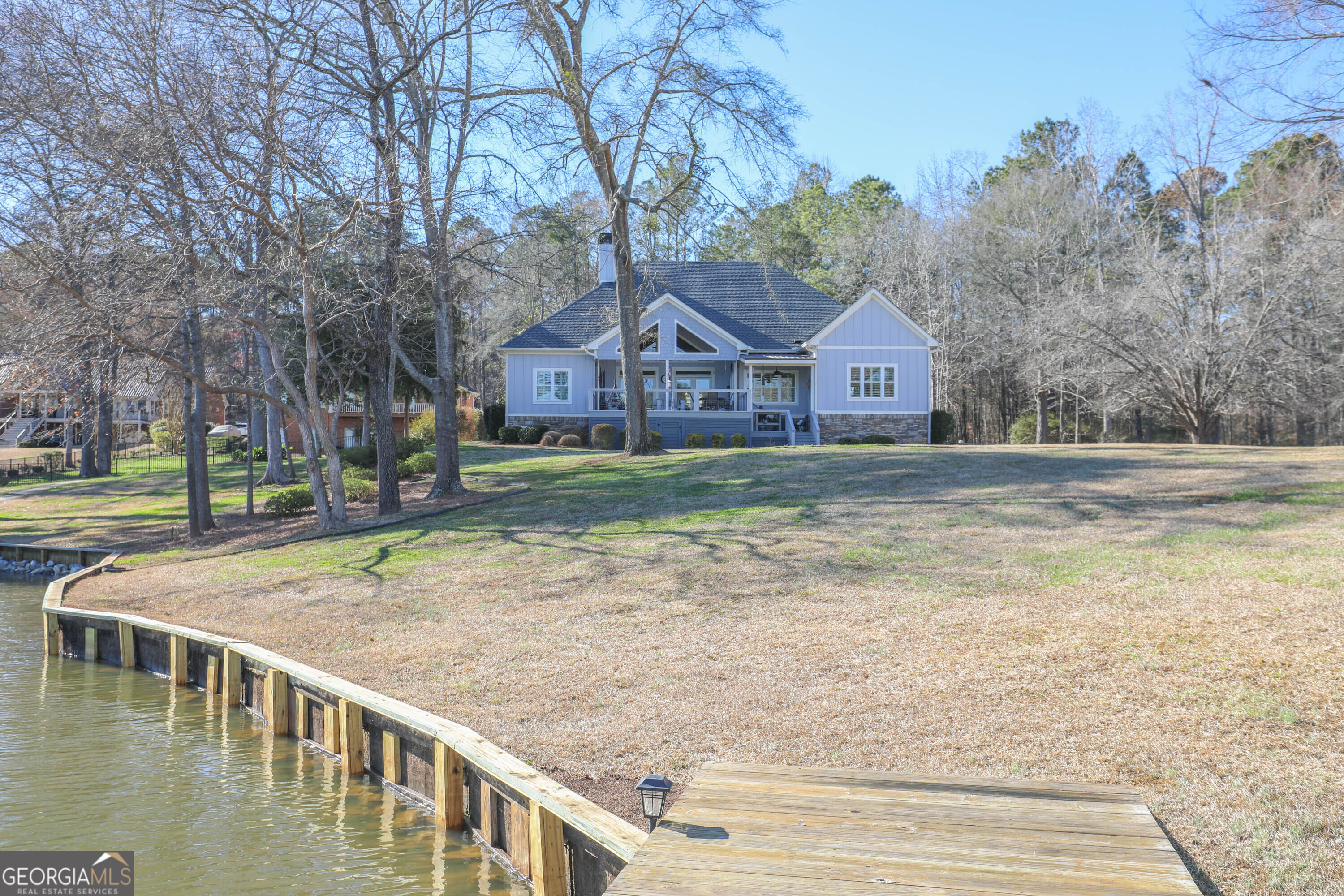 124 Myrick Road Northwest Milledgeville, GA 31061 - Photo 8 of 41 a view of a house with a yard and large trees