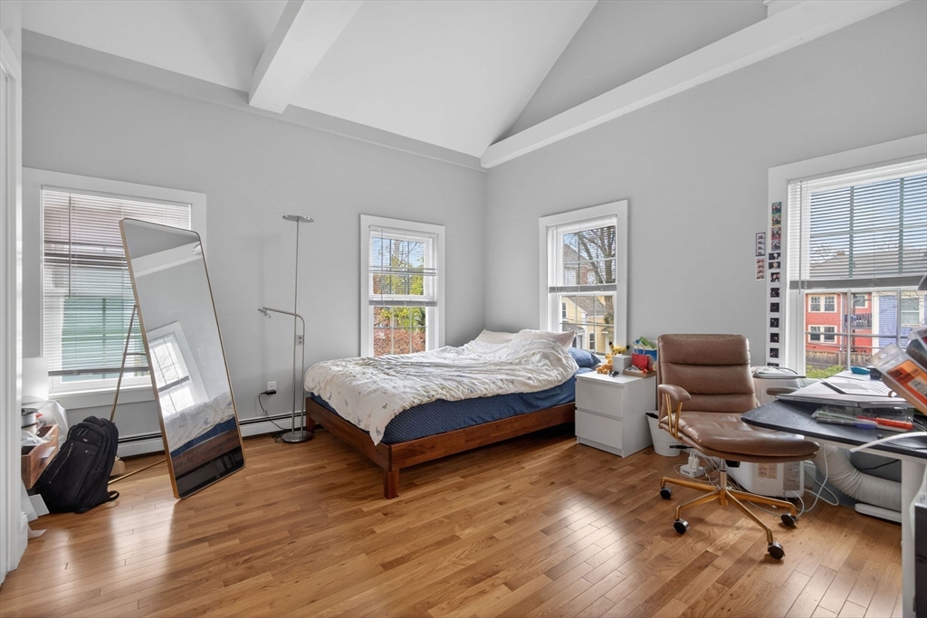 50 Roberts Road Cambridge, MA 02138 - Photo 11 of 25 a bedroom with a bed and wooden floor