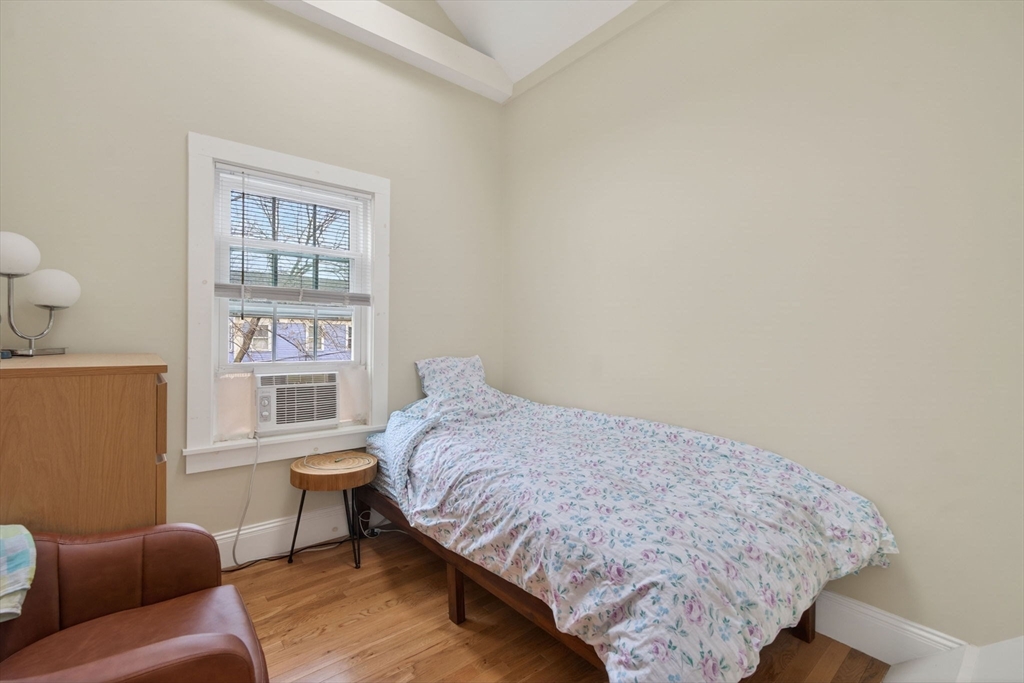 50 Roberts Road Cambridge, MA 02138 - Photo 14 of 25 a bedroom with a bed and a couch next to a window