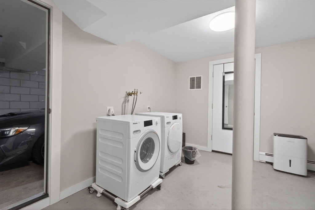 50 Roberts Road Cambridge, MA 02138 - Photo 17 of 25 a utility room with dryer and washer