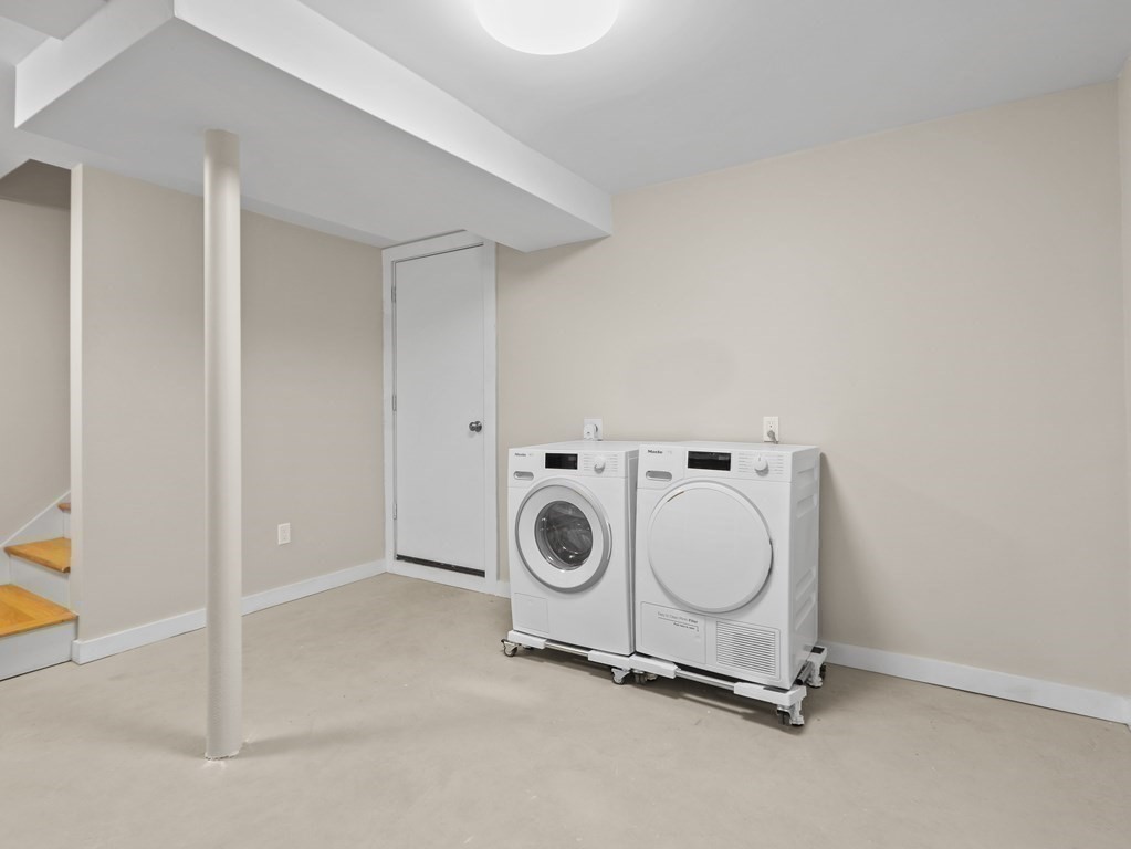 50 Roberts Road Cambridge, MA 02138 - Photo 18 of 25 a utility room with dryer and washer