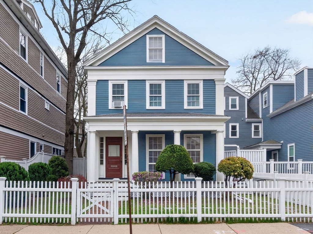 50 Roberts Road Cambridge, MA 02138 - Photo 20 of 25 a front view of a house with a fence