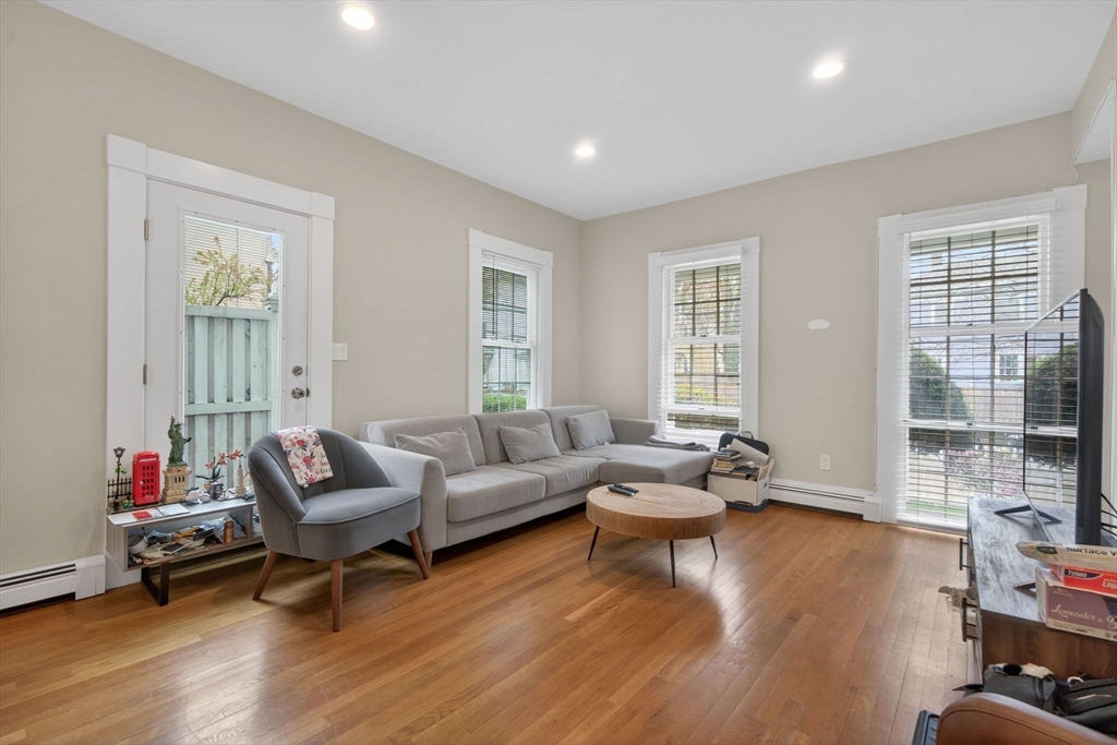 50 Roberts Road Cambridge, MA 02138 - Photo 5 of 25 a living room with furniture and a wooden floor