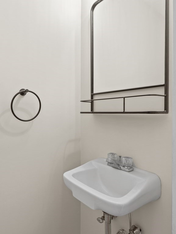 50 Roberts Road Cambridge, MA 02138 - Photo 8 of 25 a bathroom with a sink and a mirror