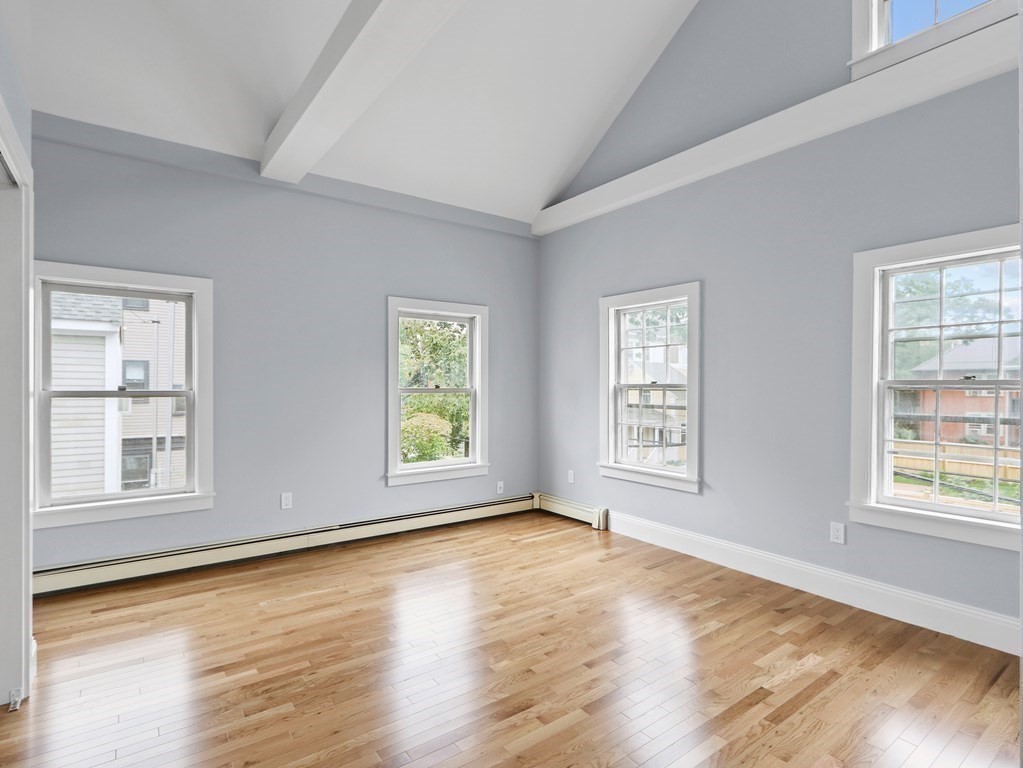 50 Roberts Road Cambridge, MA 02138 - Photo 10 of 25 a view of empty room with wooden floor and fan