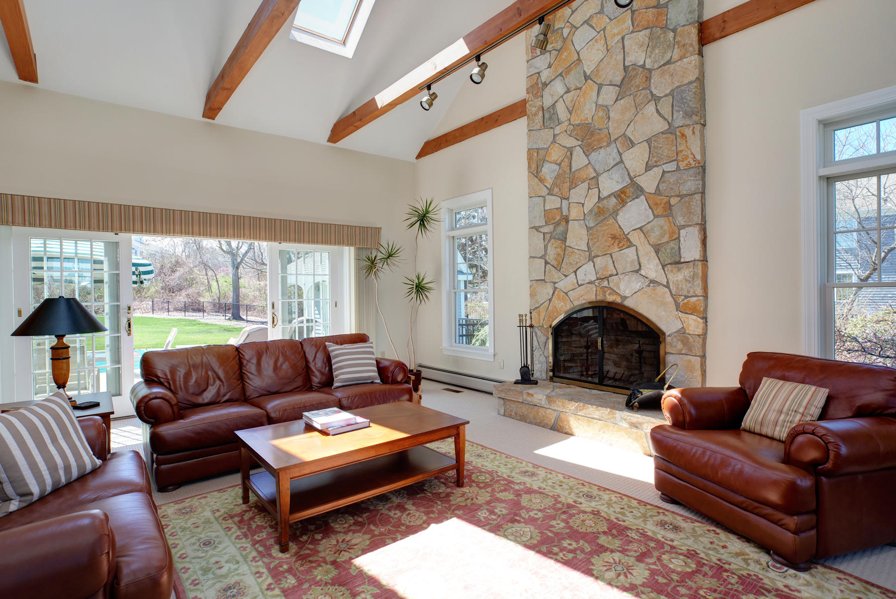 40 Torrey Road East Sandwich, MA 02537 - Photo 24 of 53 a living room with furniture a large window and a fireplace