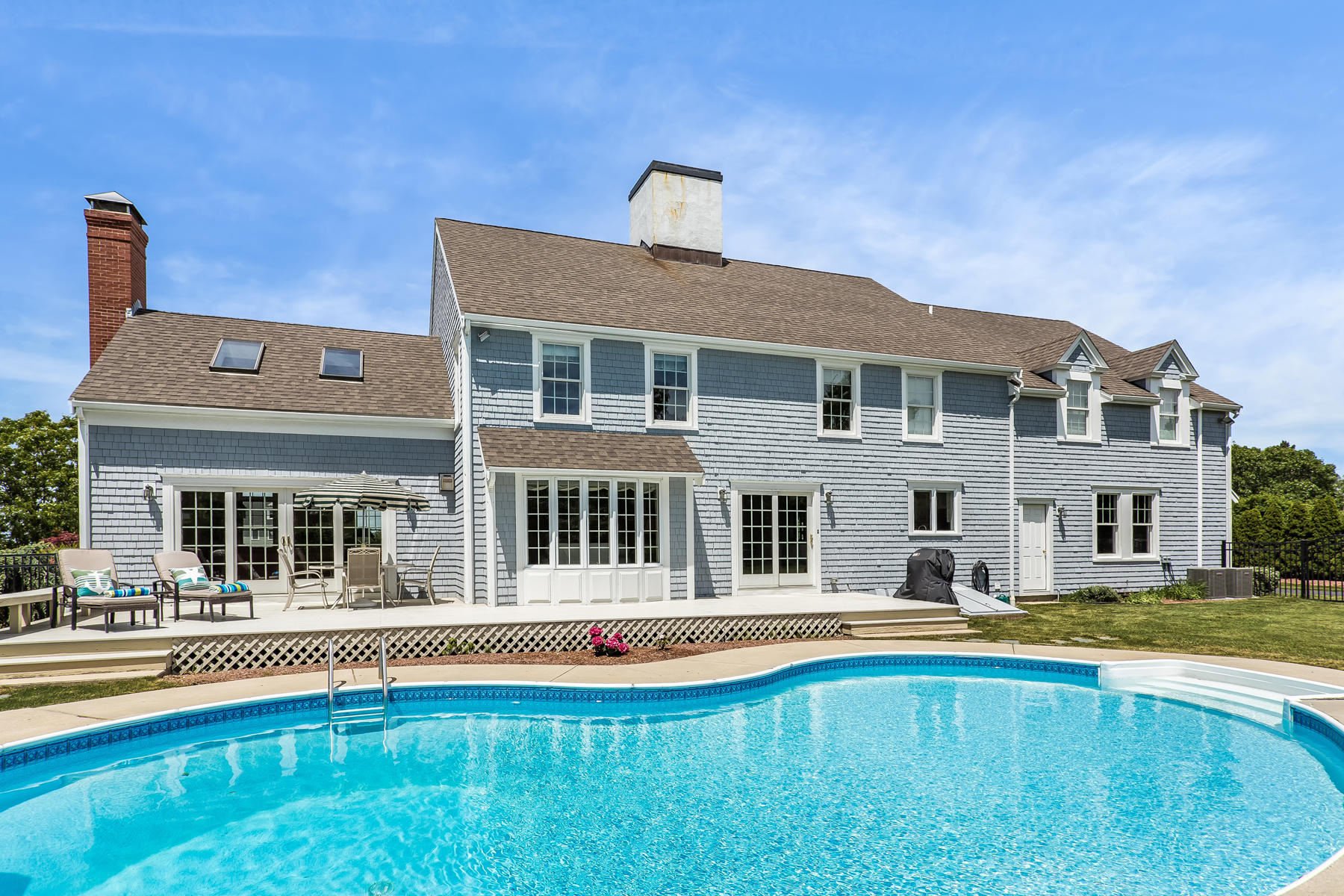 40 Torrey Road East Sandwich, MA 02537 - Photo 47 of 53 a house that has a large pool in front of it