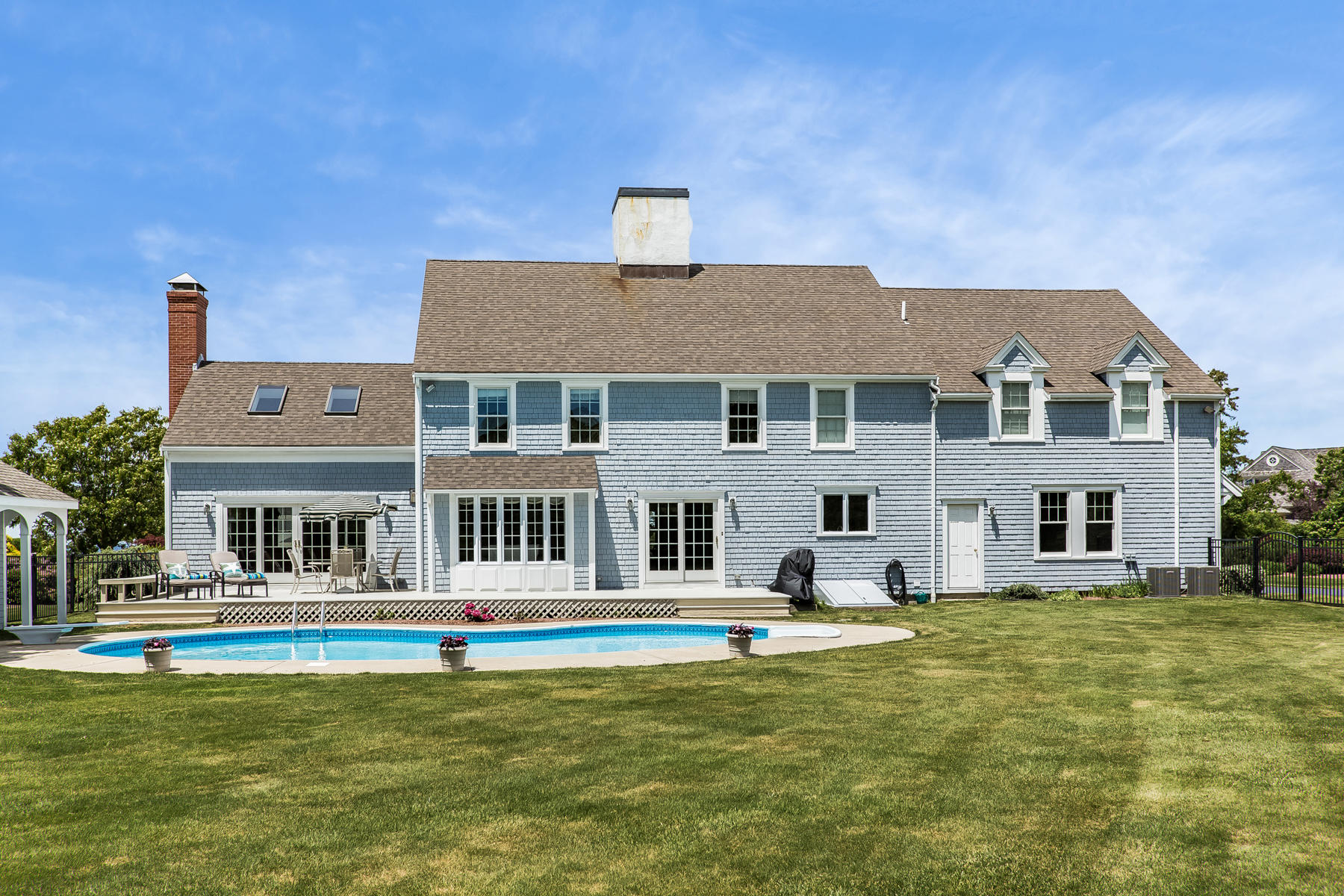 40 Torrey Road East Sandwich, MA 02537 - Photo 5 of 53 a front view of a building with a swimming pool