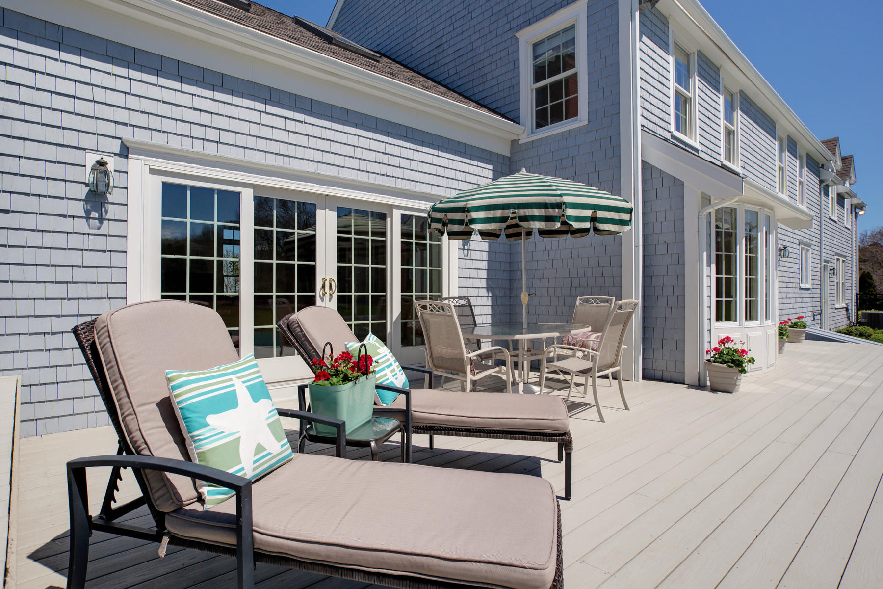 40 Torrey Road East Sandwich, MA 02537 - Photo 8 of 53 a view of a patio with table and chairs and wooden floor
