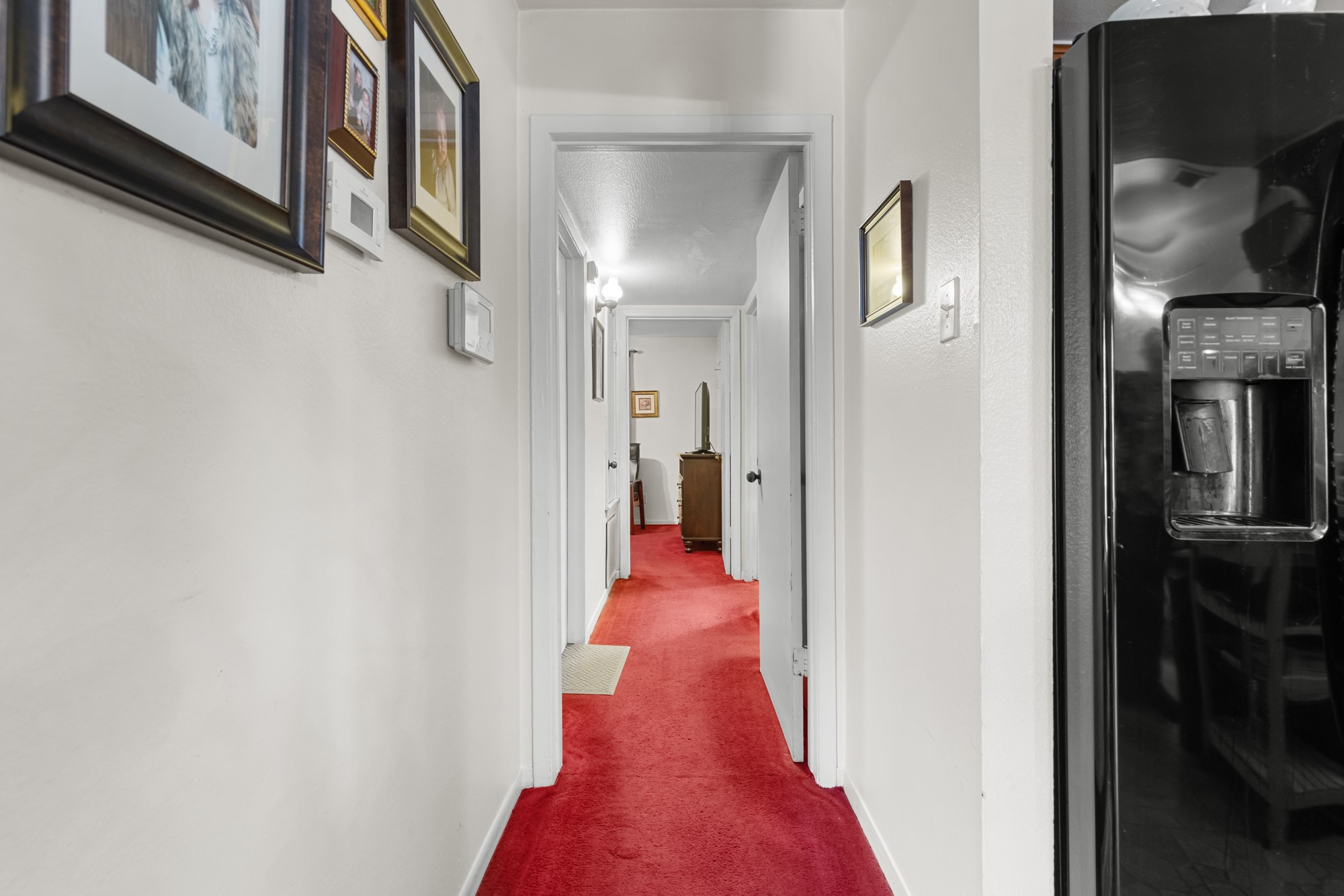 3622 Beau Lane Houston, TX 77039 - Photo 5 of 13 a view of a hallway with wooden floor and living room