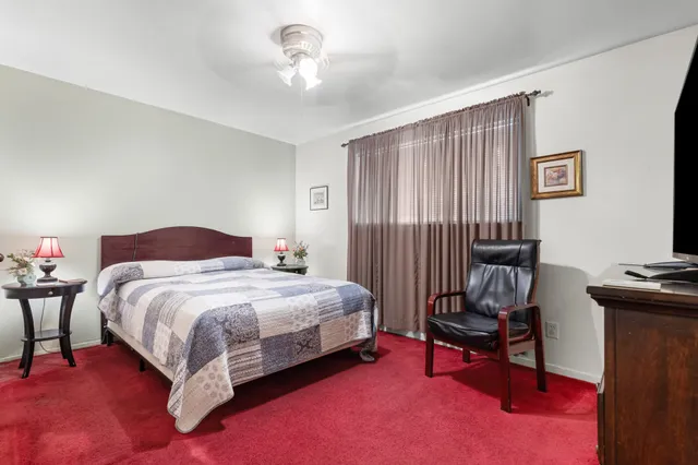 a bedroom with a bed and a furniture