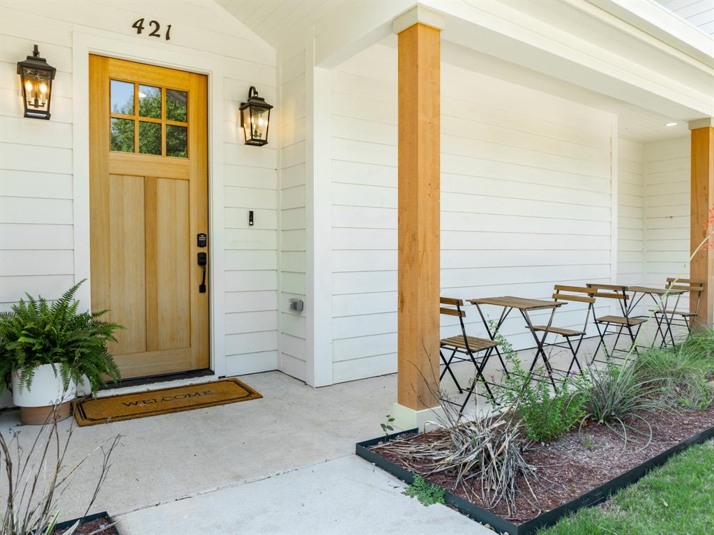 421 Proctor Avenue Waco, TX 76708 - Photo 1 of 28 a front view of a house with a garden